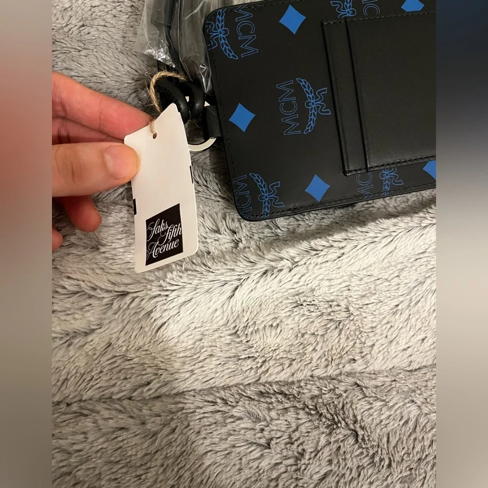 NEW NWT MCM LOGO PHONE LANYARD VALLARTA BLUE BLACK AUTHENTIC INCL SAKS TAG
